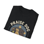 Praise Dog From Whom All Blessings Flow Labrador T-Shirt folded view in black, showing the Praise Dog sunburst badge graphic with a golden Labrador at center.