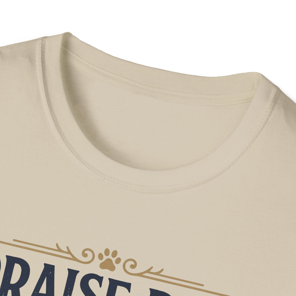 Praise Dog From Whom All Blessings Flow Golden Retriever T-Shirt close-up detail of the collar area on a natural tan shirt, showing paw print and scroll accents of the Praise Dog graphic.
