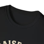 Praise Dog From Whom All Blessings Flow Labrador T-Shirt close-up detail of the collar area on a black shirt, showing the top of the Praise Dog text graphic.