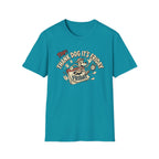 Thank Dog It's Friday T-Shirt flat lay on teal shirt featuring a retro cartoon dog leaping through a Friday calendar with TDIF: Thank Dog It's Friday graphic design.