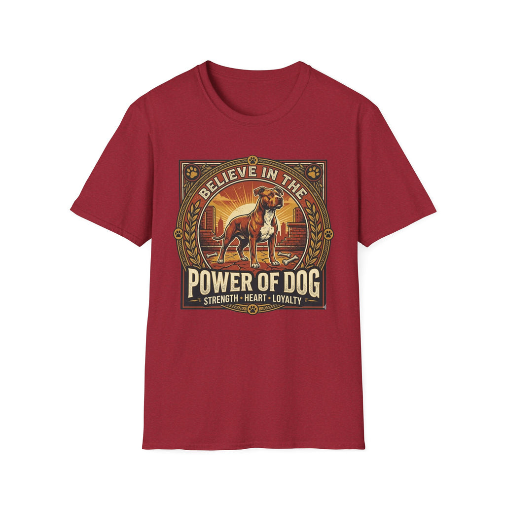 Believe in the Power of Dog Pitbull Cityscape T-Shirt in cardinal red, flat lay, featuring a retro-style badge graphic of a muscular brown and white Pitbull standing proudly before a warm urban cityscape at sunset, with text reading Believe in the Power of Dog and Strength, Heart, Loyalty.