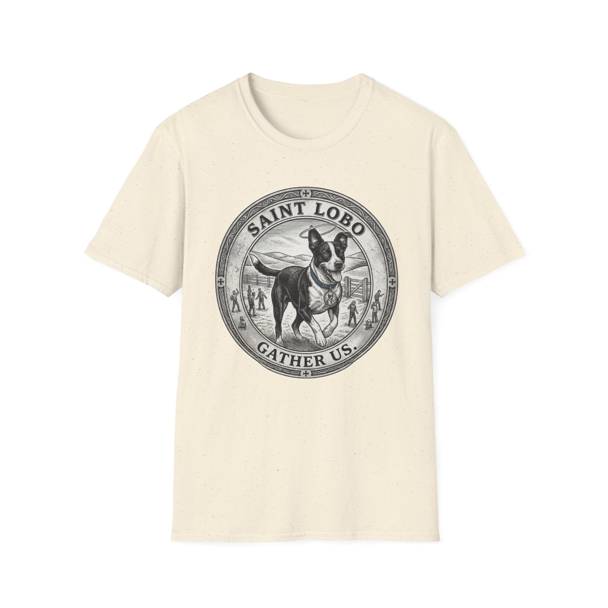 Saint Lobo Gather Us T-Shirt flat lay in natural/cream, featuring a vintage medallion graphic of a leaping border collie-style dog with a halo, surrounded by the text 'Saint Lobo — Gather Us.'