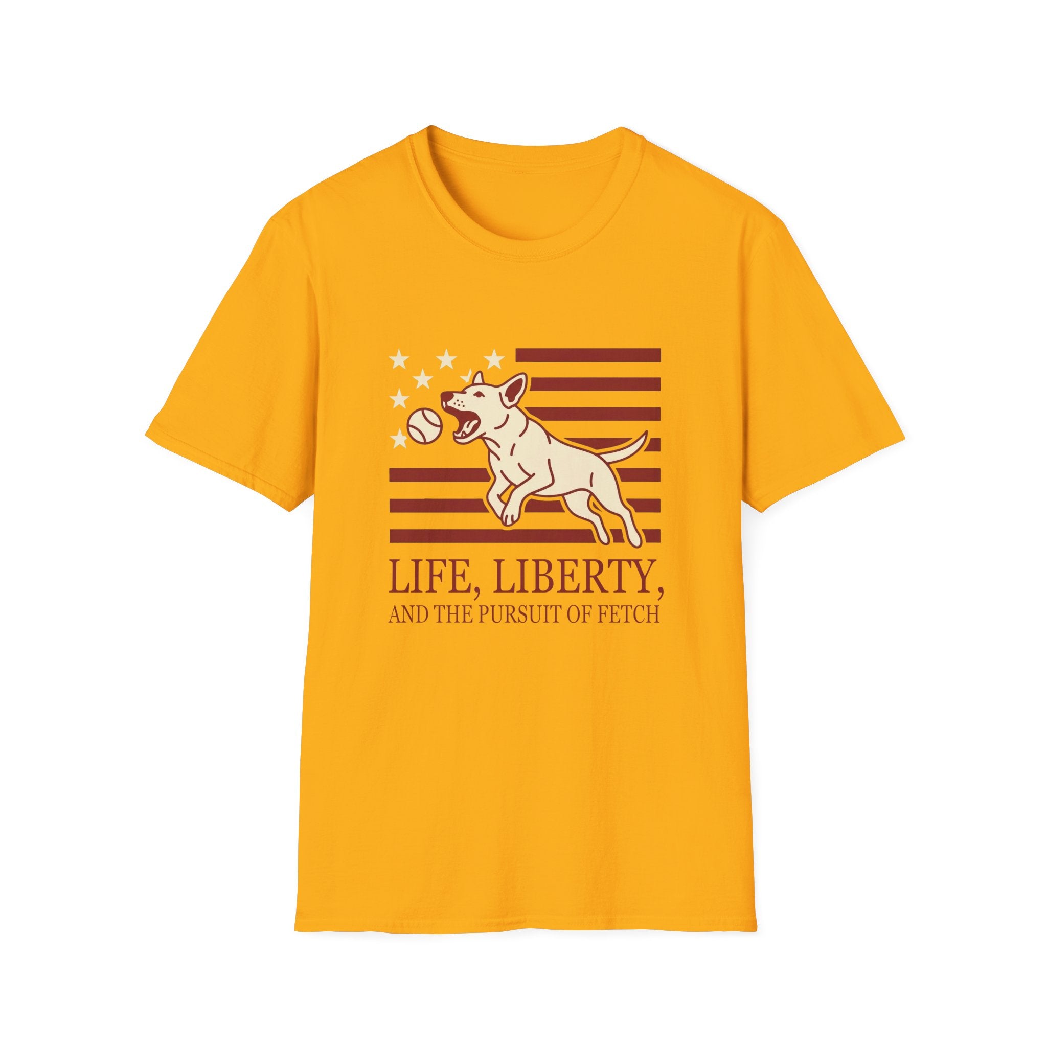 Pursuit of Fetch T-Shirt flat lay in gold yellow, featuring a leaping dog catching a tennis ball over a flag of red stripes and stars, with text reading 'Life, Liberty, and the Pursuit of Fetch.'