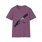 Let Go Let Dog Paw T-Shirt, flat lay on heather purple tee featuring a bold silhouette graphic of a human hand reaching toward a dog paw with the text Let go and let Dog.