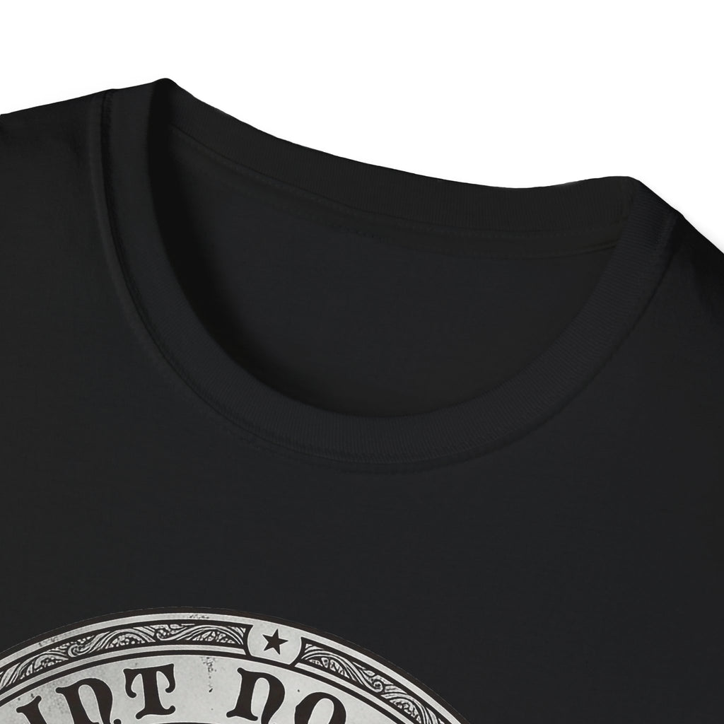Saint Noodles Guide Us T-Shirt close-up detail on black shirt showing the circular border and top portion of the basset hound Saint Noodles medallion graphic.