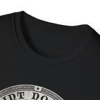 Saint Noodles Guide Us T-Shirt close-up detail on black shirt showing the circular border and top portion of the basset hound Saint Noodles medallion graphic.