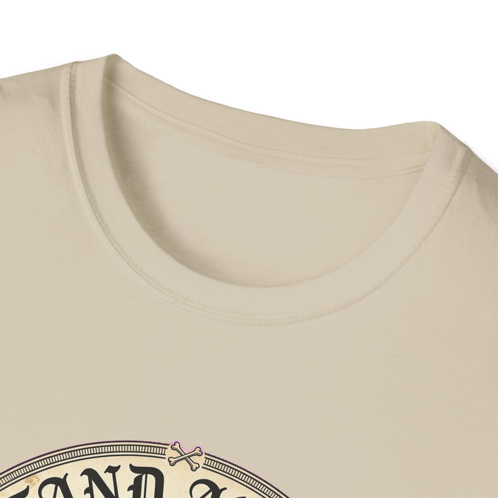 I Stand Amazed Chihuahua T-Shirt in sand, close-up of the neckline and upper graphic detail showing the circular Chihuahua design with crossed-bone medallion and vintage lettering.