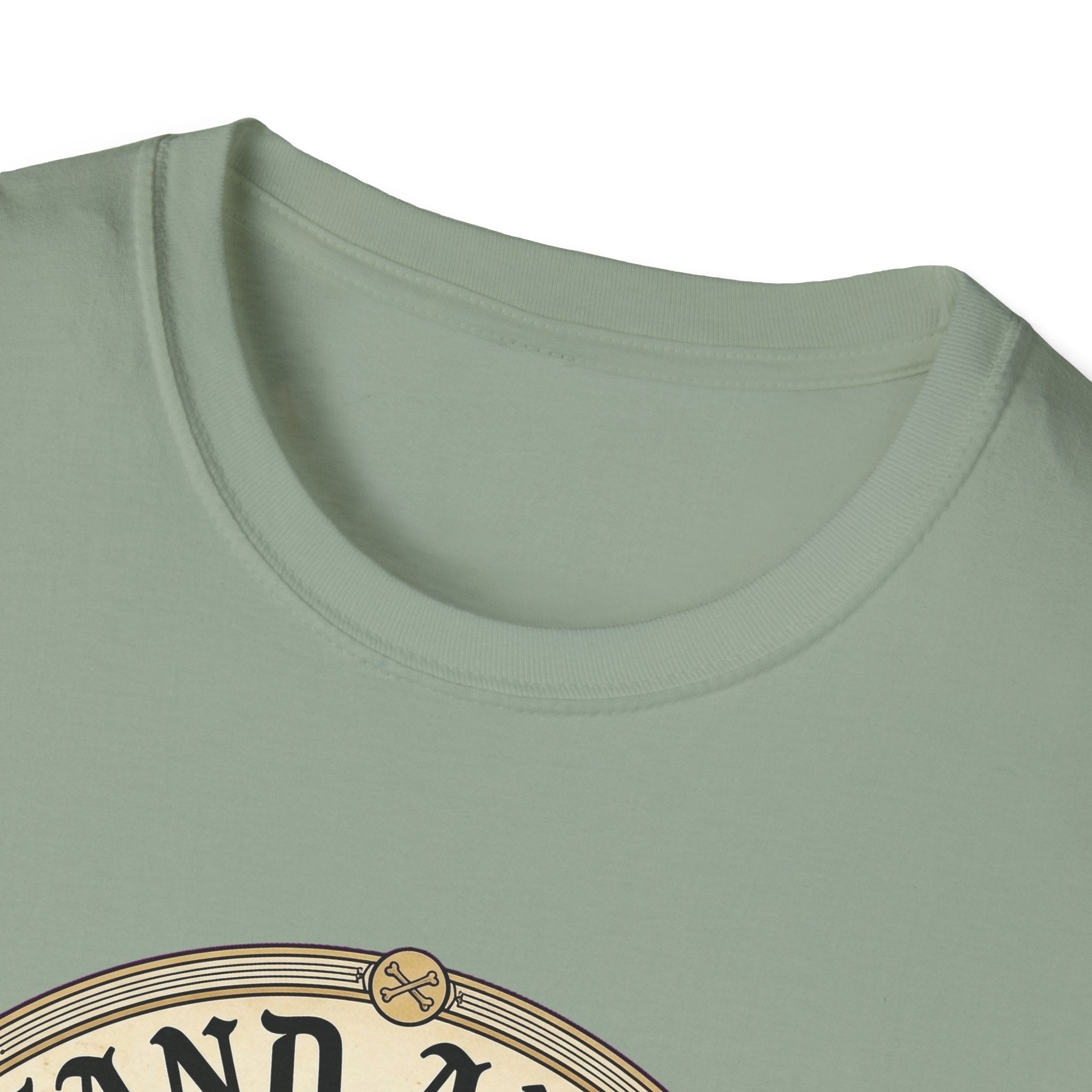 I Stand Amazed Golden Retriever T-Shirt close-up of the neckline on a sage green shirt, showing the top arc of the circular golden retriever graphic.