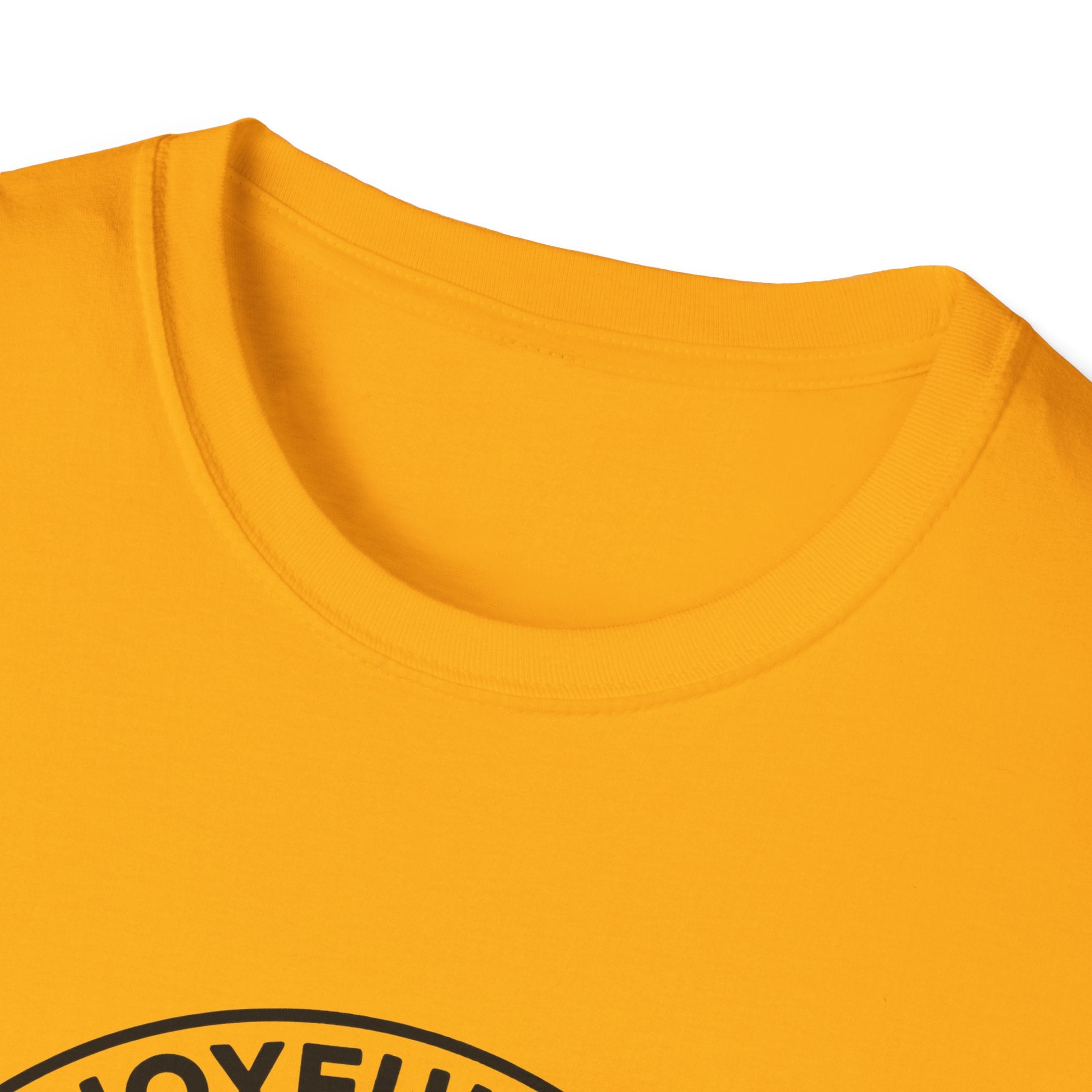The Joyful Sound of Barking T-shirt close-up detail shot on a gold shirt, showing the circular badge graphic with the 'Joyful Sound' lettering at the neckline.