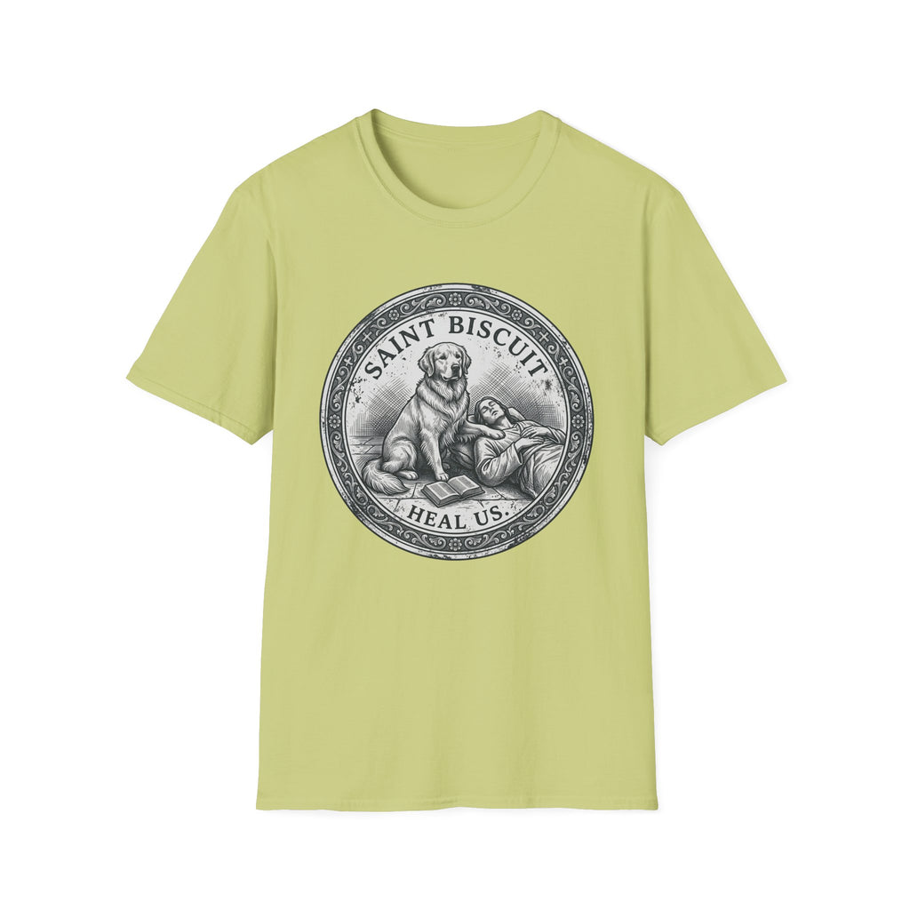 Saint Biscuit Heal Us T-shirt flat lay in light yellow-green, featuring a vintage-style medallion graphic of a golden retriever dog watching over a reclining figure with the text 'Saint Biscuit Heal Us'.