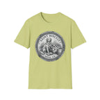 Saint Biscuit Heal Us T-shirt flat lay in light yellow-green, featuring a vintage-style medallion graphic of a golden retriever dog watching over a reclining figure with the text 'Saint Biscuit Heal Us'.