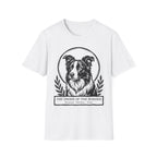 Holy Orders | Border Collie T-Shirt flat lay on sage green shirt featuring a stained glass style illustration of a Border Collie depicted as a holy figure with a golden halo and the text 'Holy Orders.'