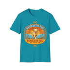 Believe in the Power of Dog Yellow Lab T-Shirt in teal, flat lay view showing a retro-style oval badge with a halo-wearing yellow Labrador running joyfully through a sunlit field, with the words 'Joy Loyalty Love' and crossed bones.