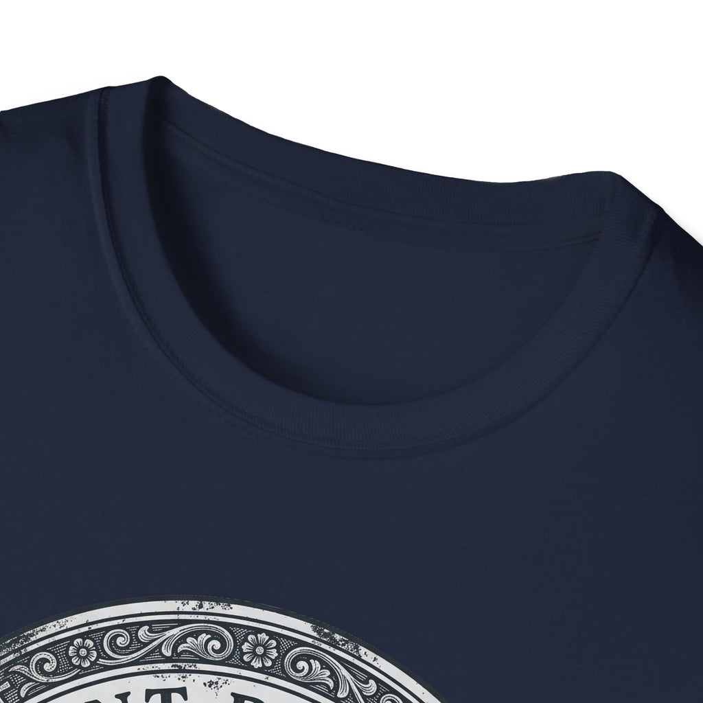 Saint Biscuit Heal Us T-shirt close-up detail on navy blue shirt showing the ornate circular border and 'Saint Biscuit' text of the vintage medallion graphic.
