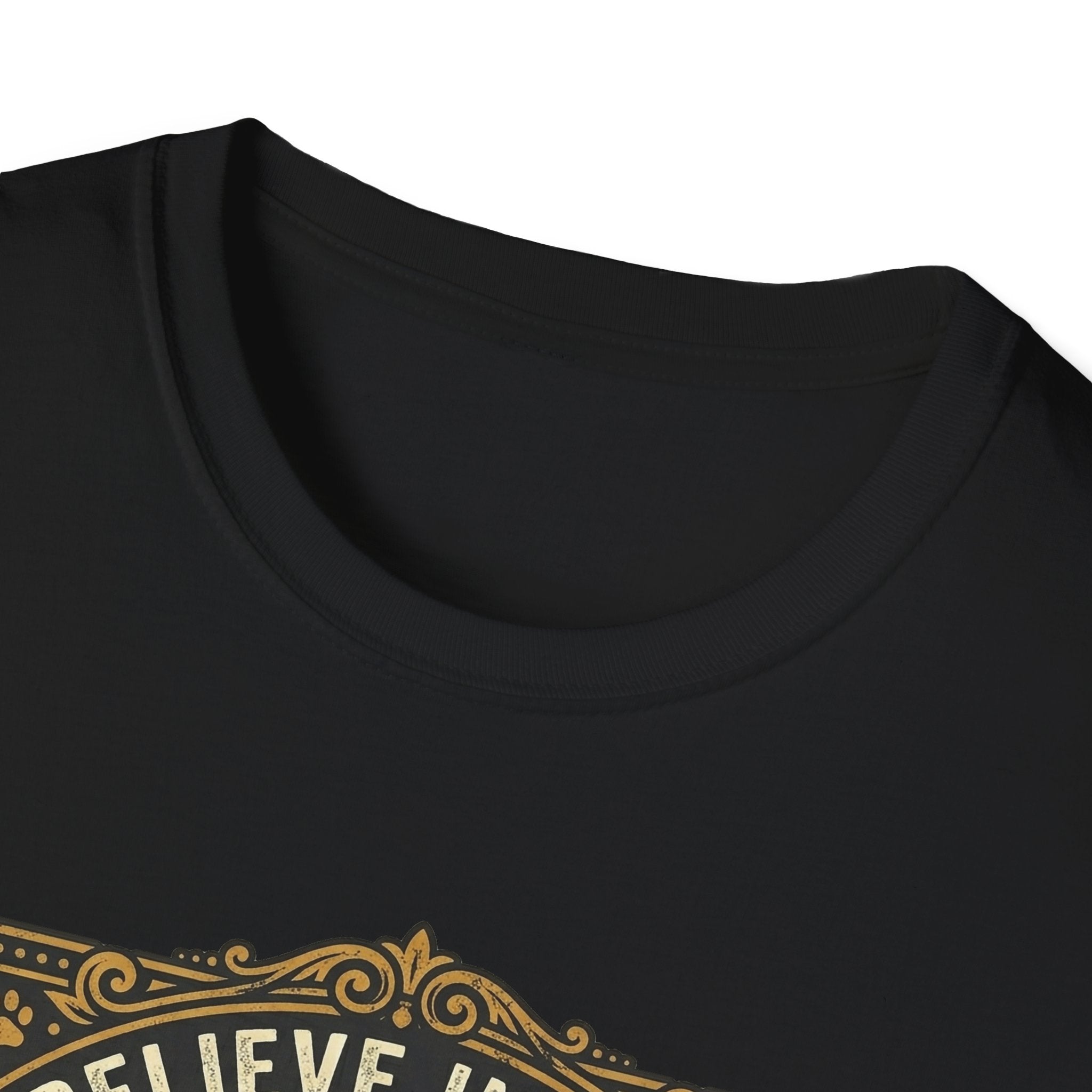 Believe in the Power of Dog T-shirt close-up detail on black shirt showing the ornate gold border and 'Believe In The' text of the vintage badge graphic.