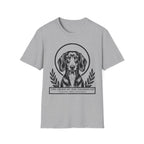 Holy Orders | Dachshund T-Shirt detail view featuring a stained glass style illustration of a Dachshund depicted as a holy figure with a golden halo and the text 'Holy Orders.'