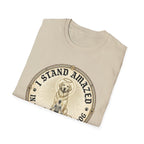 I Stand Amazed Golden Retriever T-Shirt folded view in sand, showing the golden retriever with halo graphic and "I Stand Amazed" text on the front chest.