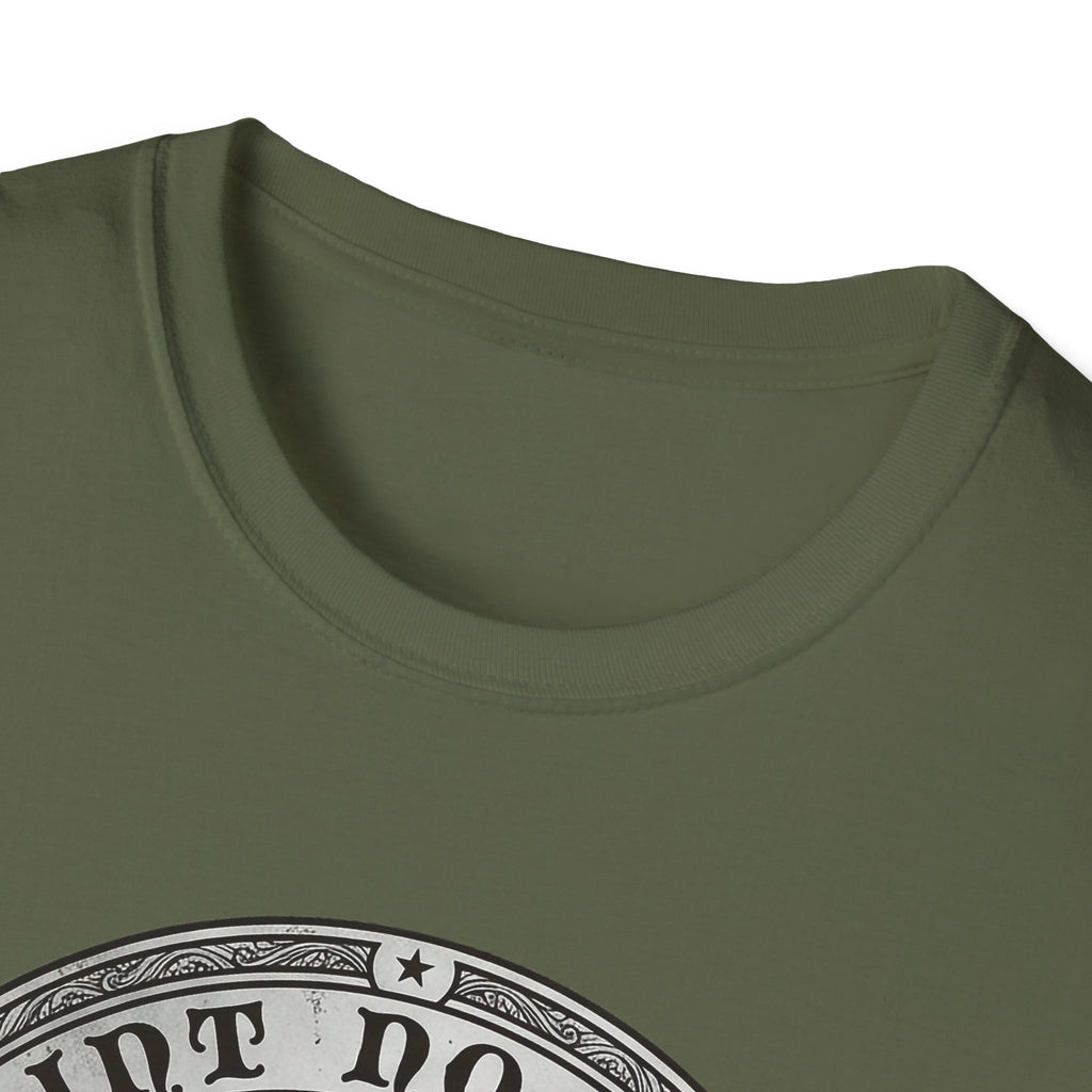 Saint Noodles Guide Us T-Shirt close-up detail on military green shirt showing the circular border and top portion of the basset hound Saint Noodles medallion graphic.