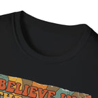 Believe in the Power of Dog Retro T-Shirt close-up detail in black, showing the collar and top edge of the retro rainbow and groovy text graphic.
