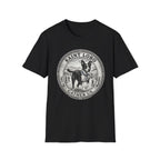Saint Lobo Gather Us T-Shirt flat lay in black, featuring a vintage medallion graphic of a leaping border collie-style dog with a halo, surrounded by the text 'Saint Lobo — Gather Us.'