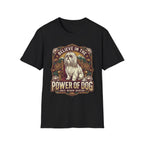 Believe in the Power of Dog Shih Tzu Throne T-Shirt in black, flat lay, featuring a vintage badge graphic of a fluffy white Shih Tzu seated regally on a throne surrounded by lotus flowers and mountains, with text reading Believe in the Power of Dog and Grace, Wisdom, Devotion.