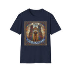 Holy Holy Holy St Bernard T-Shirt flat lay on navy, featuring a stained-glass-style illustration of a St Bernard seated before cathedral arches with the text 'Holy Holy Holy Lord Dog Almighty'.