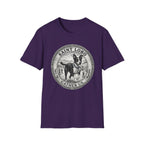Saint Lobo Gather Us T-Shirt flat lay in purple, featuring a vintage medallion graphic of a leaping border collie-style dog with a halo, surrounded by the text 'Saint Lobo — Gather Us.'