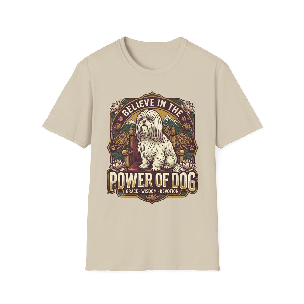 Believe in the Power of Dog Shih Tzu Throne T-Shirt in natural tan, flat lay, featuring a vintage badge graphic of a fluffy white Shih Tzu seated regally on a throne surrounded by lotus flowers and mountains, with text reading Believe in the Power of Dog and Grace, Wisdom, Devotion.