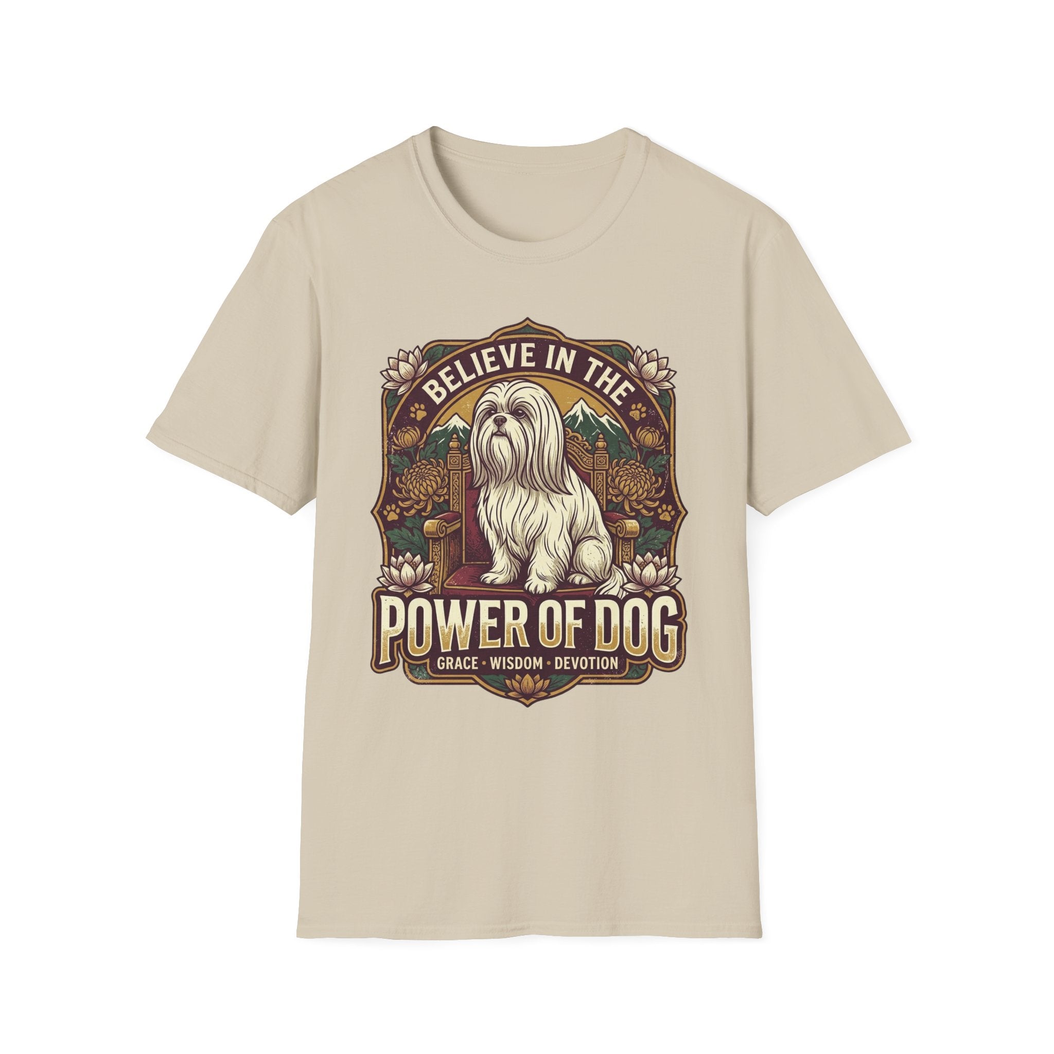 Believe in the Power of Dog Shih Tzu Throne T-Shirt in natural tan, flat lay, featuring a vintage badge graphic of a fluffy white Shih Tzu seated regally on a throne surrounded by lotus flowers and mountains, with text reading Believe in the Power of Dog and Grace, Wisdom, Devotion.