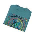 Praise Dog From Whom All Blessings Flow Geometric T-Shirt folded view in teal, showing the colorful pop-art geometric dog graphic with Praise Dog lettering.
