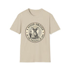 I Stand Amazed Chihuahua T-Shirt in sand, flat lay front view featuring a vintage-style circular graphic of a Chihuahua with a halo seated above a small human figure bowing in reverence, with the text 'I Stand Amazed in the Presence of Dog.'
