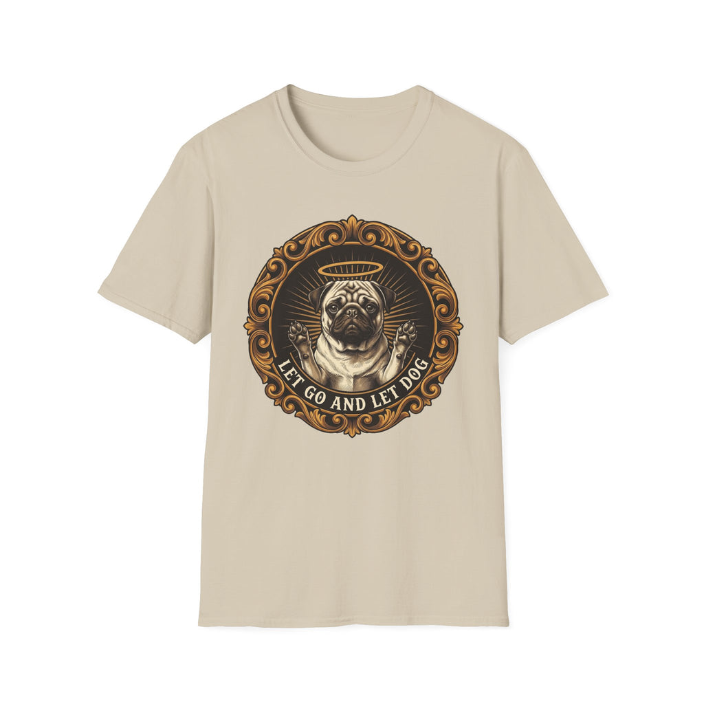 Let Go Let Dog Pug T-Shirt flat lay on sand, featuring an ornate gold-framed medallion with a halo-wearing pug raising its paws and the text 'Let Go and Let Dog'.