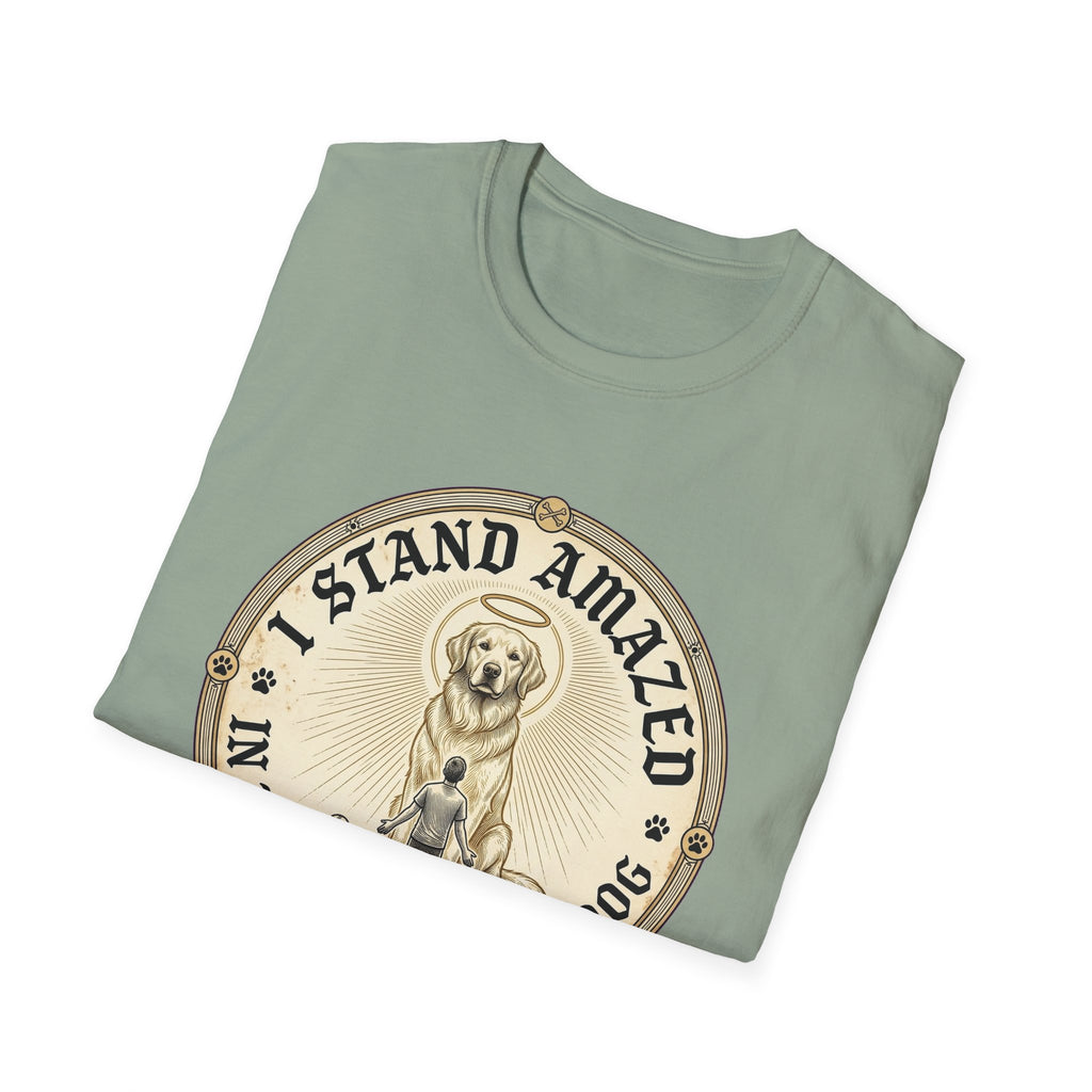 I Stand Amazed Golden Retriever T-Shirt folded view in sage green, showing the golden retriever with halo graphic and "I Stand Amazed" text on the front chest.