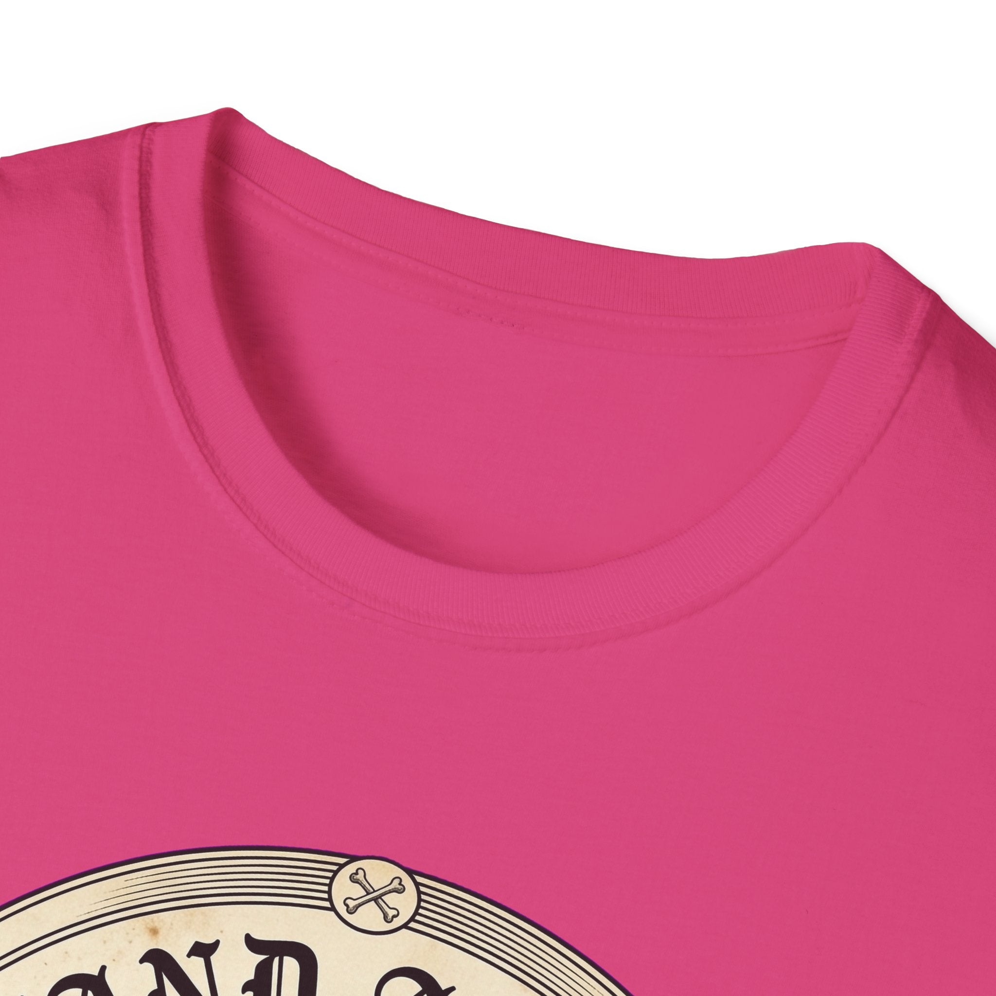 I Stand Amazed Rescue Mutt T-Shirt in hot pink, close-up of the neckline and upper graphic detail showing the circular rescue mutt design with crossed-bone medallion and vintage lettering.
