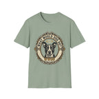 What Would Dog Do T-Shirt flat lay on sage green shirt featuring an ornate vintage frame design with a halo-wearing pit bull and the text What Would Dog Do? WWDD.