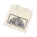 A Mighty Fortress is Our Dog T-Shirt folded view in natural/cream showing the gothic cathedral graphic with dog in doorway and ornate border.