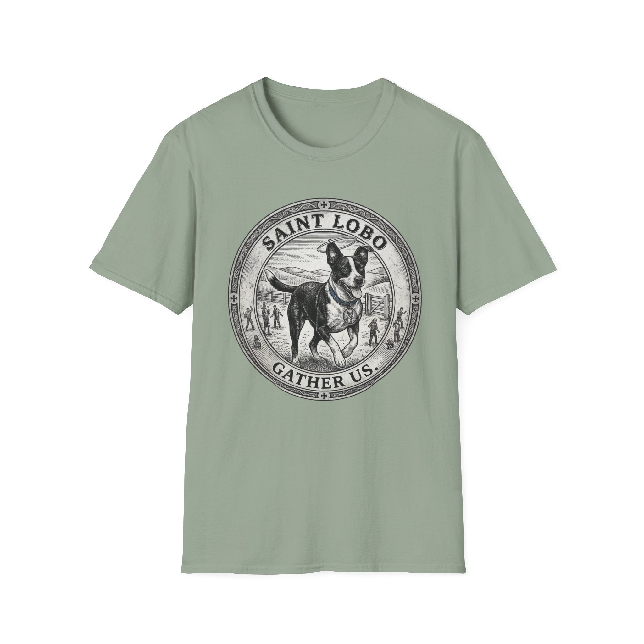 Saint Lobo Gather Us T-Shirt flat lay in sage green, featuring a vintage medallion graphic of a leaping border collie-style dog with a halo, surrounded by the text 'Saint Lobo — Gather Us.'