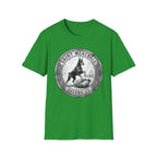 Saint Meatball Defend Us T-Shirt flat lay on bright green shirt featuring a vintage medallion design with a Doberman Pinscher saint and the text Saint Meatball Defend Us.