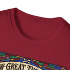How Great Thou Bark Golden Retriever T-shirt close-up detail shot on a cardinal red shirt, showing the colorful stained-glass style graphic with crossbones and 'How Great Thou Bark' lettering at the neckline.