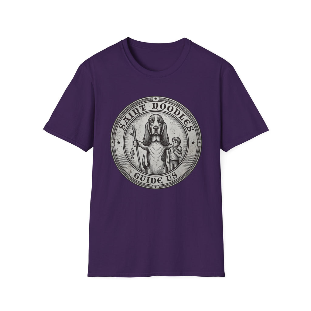 Saint Noodles Guide Us T-Shirt flat lay in purple, featuring a vintage medallion graphic of a basset hound standing upright holding a staff with a fish, alongside a small child, with the text 'Saint Noodles Guide Us'.