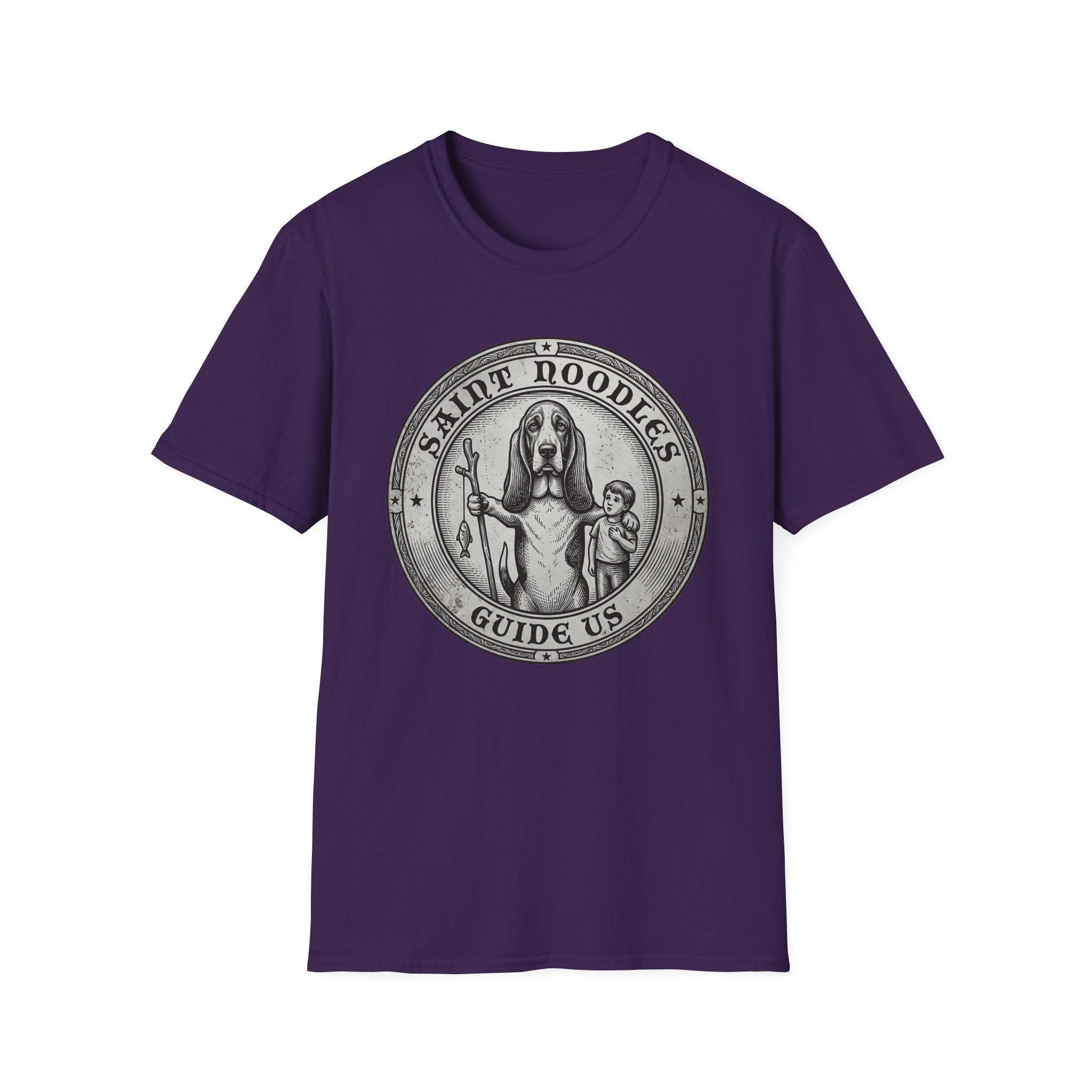 Saint Noodles Guide Us T-Shirt flat lay in purple, featuring a vintage medallion graphic of a basset hound standing upright holding a staff with a fish, alongside a small child, with the text 'Saint Noodles Guide Us'.