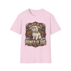 Believe in the Power of Dog Shih Tzu Throne T-Shirt in light pink, flat lay, featuring a vintage badge graphic of a fluffy white Shih Tzu seated regally on a throne surrounded by lotus flowers and mountains, with text reading Believe in the Power of Dog and Grace, Wisdom, Devotion.