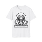 Holy Orders | Dachshund T-Shirt flat lay on navy shirt featuring a stained glass style illustration of a Dachshund depicted as a holy figure with a golden halo and the text 'Holy Orders.'