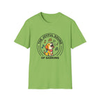 The Joyful Sound of Barking T-shirt flat lay, kiwi green shirt featuring a circular badge graphic of a cartoon yellow dog with a red bandana howling joyfully with musical notes and the text 'The Joyful Sound of Barking.'