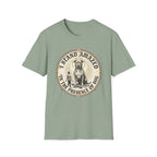 I Stand Amazed Pitbull T-Shirt in sage green, flat lay front view showing a vintage-style circular graphic of a pitbull with a halo seated above a small human figure, with the text 'I Stand Amazed in the Presence of Dog.'