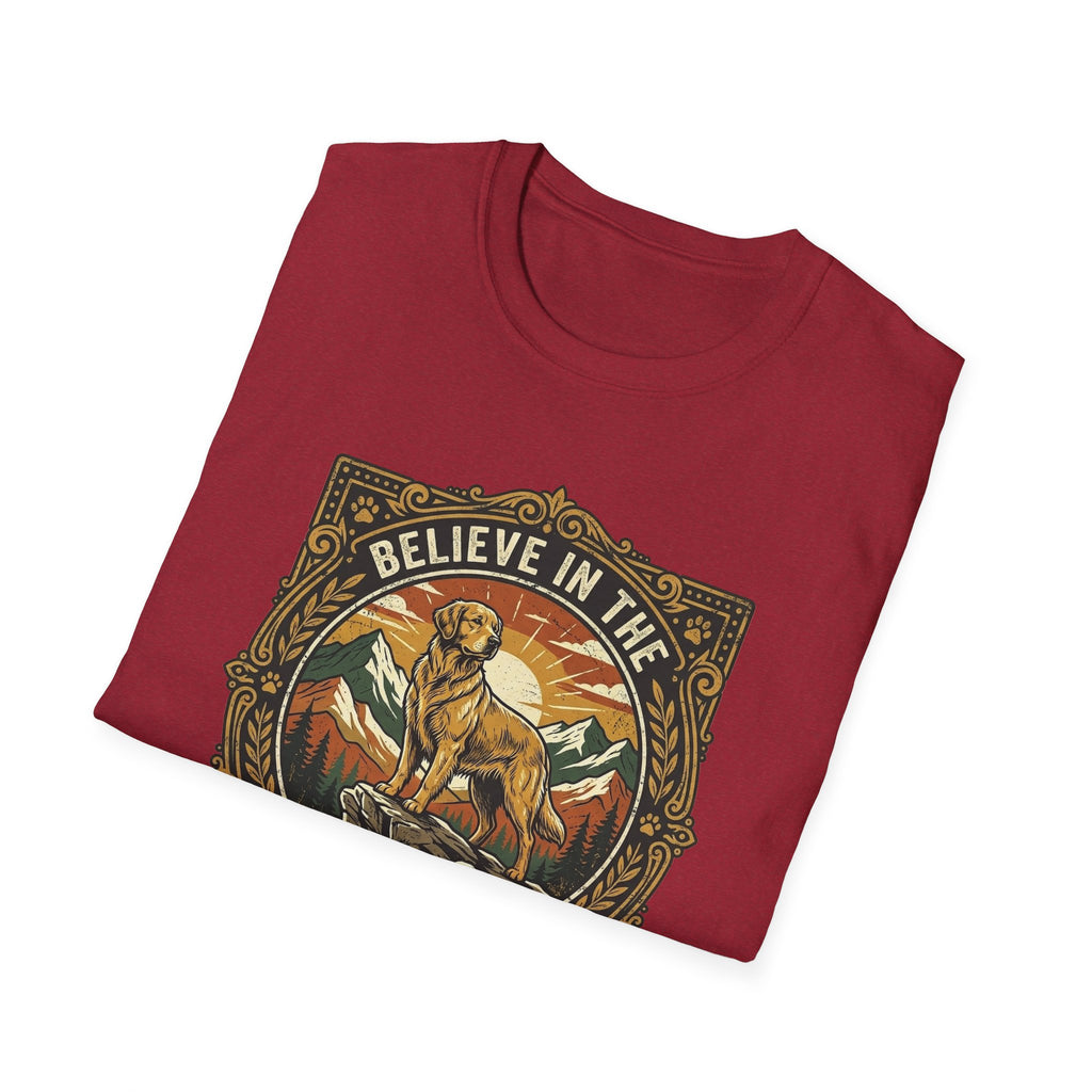 Believe in the Power of Dog T-shirt folded flat lay in cardinal red, showing the ornate vintage badge graphic of a Labrador on a rocky mountain outcrop with 'Believe in the' arched text at top.