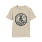 Saint Waffles Protect Us T-Shirt flat lay in natural cream, featuring a vintage medallion graphic of a Rottweiler standing protectively beside a small child with the text Saint Waffles Protect Us.