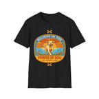 Believe in the Power of Dog Yellow Lab T-Shirt in black, flat lay view showing a retro-style oval badge with a halo-wearing yellow Labrador running joyfully through a sunlit field, with the words 'Joy Loyalty Love' and crossed bones.
