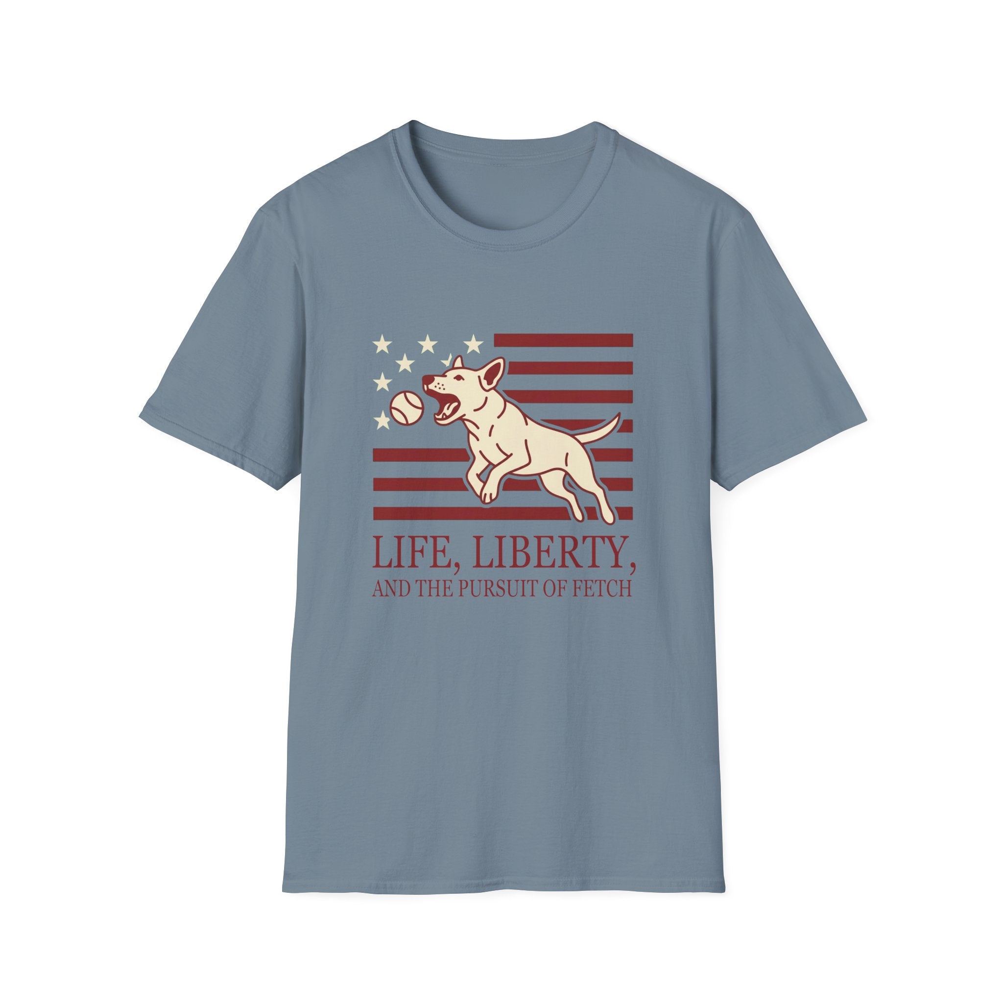 Pursuit of Fetch T-Shirt flat lay in slate blue, featuring a leaping dog catching a tennis ball over a flag of red stripes and stars, with text reading 'Life, Liberty, and the Pursuit of Fetch.'
