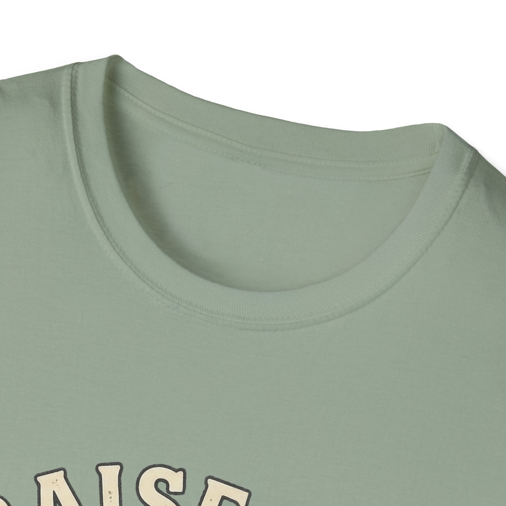 Praise Dog From Whom All Blessings Flow Labrador T-Shirt close-up detail of the collar area on a sage green shirt, showing the top of the Praise Dog text graphic.